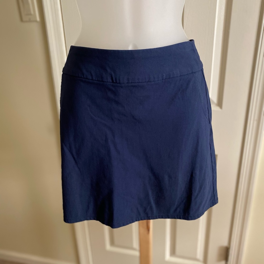 IZOD - Woman’s navy blue golf skort, Size: 4